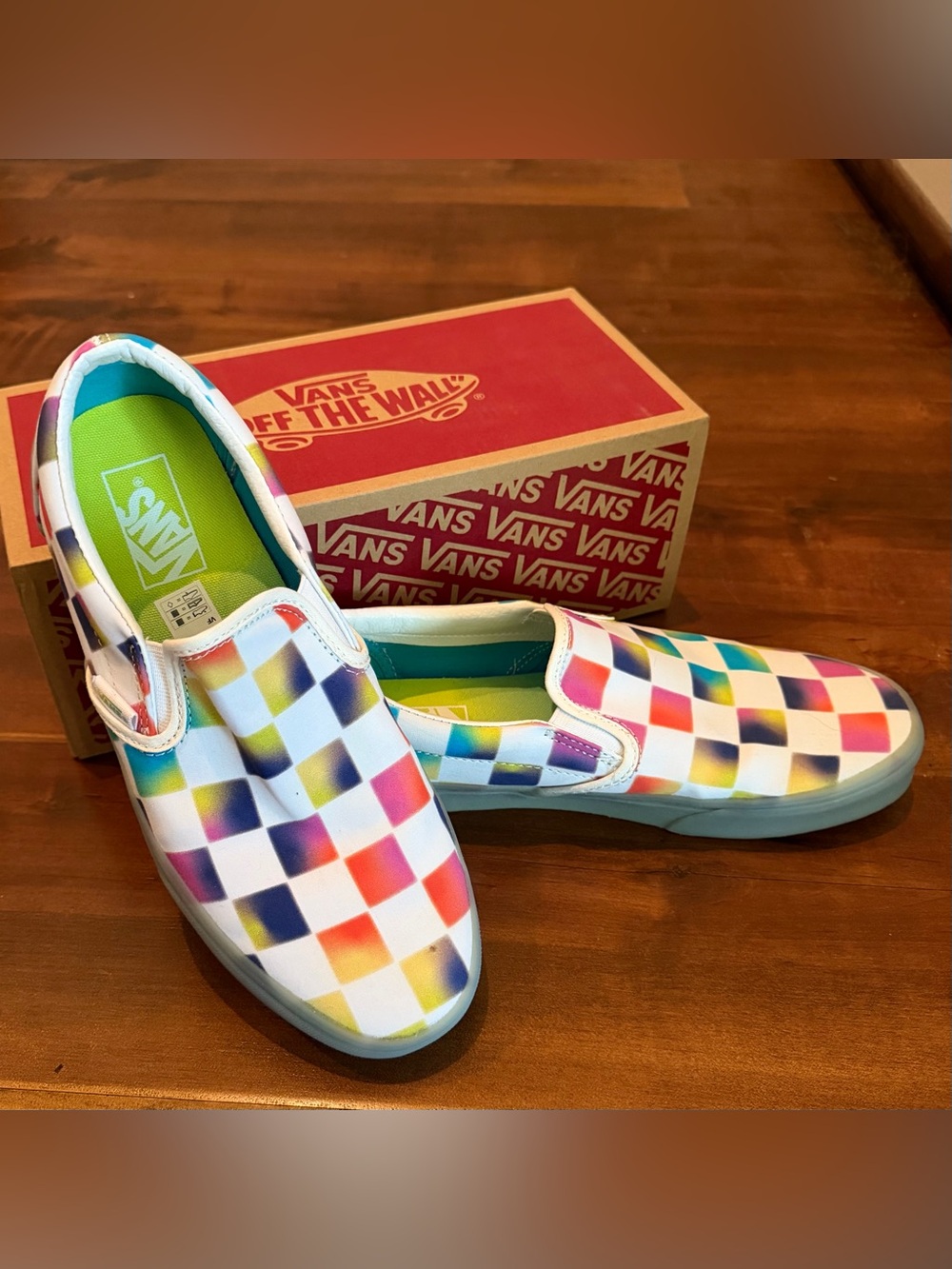 Vans Women’s Slip-On Checkerboard Sneakers in White with Rainbow Accent Squares
